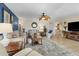 Spacious living room with plush seating, elegant decor, and abundant natural light at 815 Montrose Dr # 103, Venice, FL 34293