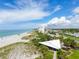 Beachfront view with white sand beach, ocean, and pavilion at 815 Montrose Dr # 103, Venice, FL 34293