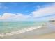 Tranquil beach with gentle waves and blue waters at 815 Montrose Dr # 103, Venice, FL 34293