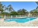Inviting community pool with lounge chairs and lush landscaping at 815 Montrose Dr # 103, Venice, FL 34293