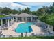 Inviting community pool with ample lounge seating and shaded areas, perfect for relaxation and socializing at 815 Montrose Dr # 103, Venice, FL 34293