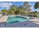 A sparkling community pool offers plenty of space for lounging on the brick deck and surrounding area at 815 Montrose Dr # 103, Venice, FL 34293
