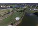 Aerial view of a golf course with water features at 815 Montrose Dr # 103, Venice, FL 34293