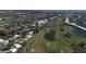 Aerial view of community with golf course and tennis courts at 815 Montrose Dr # 103, Venice, FL 34293