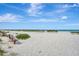 Scenic beach with benches and dune vegetation at 830 The Esplanade N # 203, Venice, FL 34285