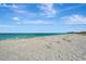 Expansive beach with clear water and blue sky at 830 The Esplanade N # 203, Venice, FL 34285