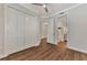 Bedroom with wood-look floors and access to bathroom at 830 The Esplanade N # 203, Venice, FL 34285