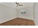 Spacious bedroom featuring wood-look floors and window shutters at 830 The Esplanade N # 203, Venice, FL 34285