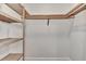 Large closet with slatted shelves for hanging clothes at 830 The Esplanade N # 203, Venice, FL 34285