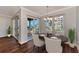 Elegant dining room with hardwood floors and chandelier at 830 The Esplanade N # 203, Venice, FL 34285