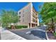 Three-story building with attached garages and landscaping at 830 The Esplanade N # 203, Venice, FL 34285