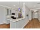 Modern kitchen with white cabinets and quartz countertops at 830 The Esplanade N # 203, Venice, FL 34285