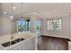 Modern kitchen with stainless steel appliances and white cabinets at 830 The Esplanade N # 203, Venice, FL 34285