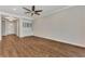 Living room with hardwood floors and built-in cabinetry at 830 The Esplanade N # 203, Venice, FL 34285