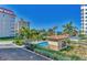 Relaxing community pool with ocean views from a balcony at 830 The Esplanade N # 203, Venice, FL 34285