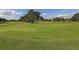 Expansive green golf course with sand traps at 885 Country Club Cir # 61, Venice, FL 34293