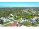 Aerial view showcasing the home's waterfront proximity and neighborhood context at 1030 Phorus Rd Rd, Venice, FL 34293