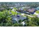 An aerial view showcasing the home's location in a residential neighborhood at 1030 Phorus Rd Rd, Venice, FL 34293