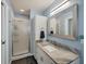 Bathroom with a marble countertop and a glass shower at 1030 Phorus Rd Rd, Venice, FL 34293