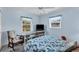 Guest bedroom with light blue walls and a metal bed frame at 1030 Phorus Rd Rd, Venice, FL 34293