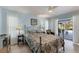 Bedroom with a metal framed bed and access to the pool area at 1030 Phorus Rd Rd, Venice, FL 34293