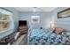 Guest bedroom with light blue walls and a metal bed frame at 1030 Phorus Rd Rd, Venice, FL 34293