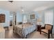 Main bedroom with light blue walls and a metal framed bed at 1030 Phorus Rd Rd, Venice, FL 34293