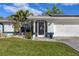 Front entrance featuring an ornate screen door and coastal-inspired accents at 1030 Phorus Rd Rd, Venice, FL 34293