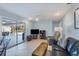 Gathering room with sliding glass doors leading to the pool at 1030 Phorus Rd Rd, Venice, FL 34293