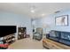 Cozy Gathering room featuring a leather couch and a wood coffee table at 1030 Phorus Rd Rd, Venice, FL 34293