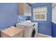 Laundry room with washer, dryer, and utility sink at 1030 Phorus Rd Rd, Venice, FL 34293