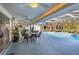 Relaxing pool area with covered patio and seating at 1030 Phorus Rd Rd, Venice, FL 34293