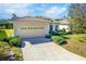 Single-Gathering home with a two-car garage and lush landscaping at 106 Corte Del Asolo, Venice, FL 34285
