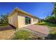 Well-maintained house with a brick patio and a manicured lawn at 106 Corte Del Asolo, Venice, FL 34285