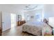 Spacious main bedroom with hardwood floors and en-suite bathroom at 106 Corte Del Asolo, Venice, FL 34285