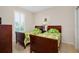 Bedroom with twin beds and green bedding at 11394 Dancing River Dr, Venice, FL 34292