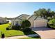 One-story home with tile roof and a two-car garage at 11394 Dancing River Dr, Venice, FL 34292