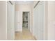 Hallway with doors to bedrooms and closets leading to the Primary bathroom at 11394 Dancing River Dr, Venice, FL 34292