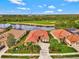 House on golf course with water view, multiple houses nearby at 1151 Creek Nine Dr, North Port, FL 34291
