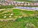 Aerial view of the property and surrounding golf course at 1151 Creek Nine Dr, North Port, FL 34291