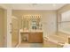Bathroom with soaking tub and walk-in shower at 1151 Creek Nine Dr, North Port, FL 34291