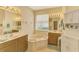 Bathroom with double vanity and soaking tub at 1151 Creek Nine Dr, North Port, FL 34291