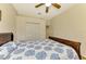 Serene bedroom with double doors and a ceiling fan at 1151 Creek Nine Dr, North Port, FL 34291