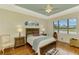 Main bedroom with wood floors and stained glass at 1151 Creek Nine Dr, North Port, FL 34291