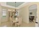 Elegant dining room with chandelier, and built-in hutch at 1151 Creek Nine Dr, North Port, FL 34291