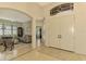 Elegant entryway with tile floor, double doors and views to living room at 1151 Creek Nine Dr, North Port, FL 34291