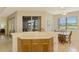 Kitchen with breakfast nook, ample counter space, and an abundance of natural light at 1151 Creek Nine Dr, North Port, FL 34291