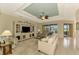 Gathering room with built-in entertainment center and access to backyard at 1151 Creek Nine Dr, North Port, FL 34291