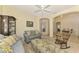 Relaxing sitting area with sectional sofa and built-in shelving at 1151 Creek Nine Dr, North Port, FL 34291