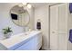 Modern bathroom with white vanity, updated fixtures, and a walk-in shower at 1174 Bird Bay Way # 107, Venice, FL 34285